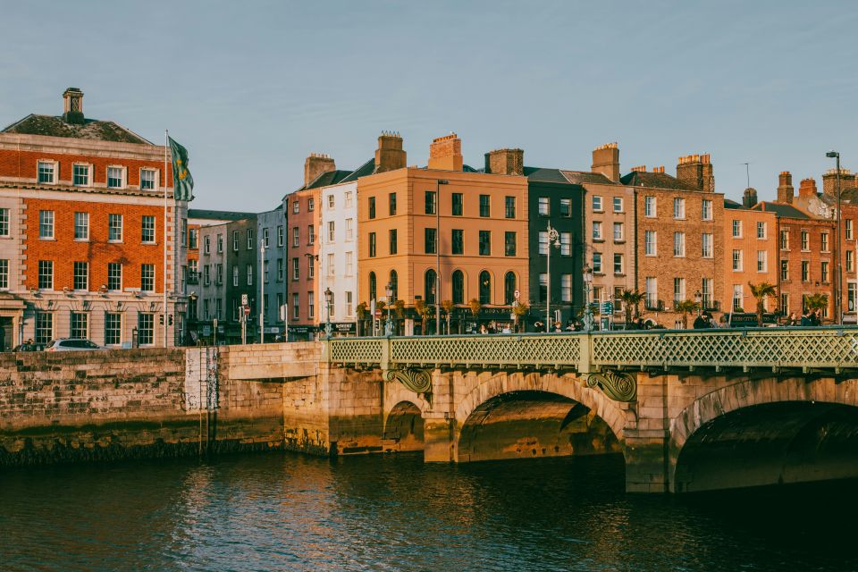Bridge over the River Liffey with colourful quayside buildings in Dublin